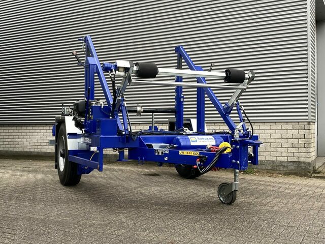 Blue Rotrex Cable Drum Trailer outside of the warehouse building