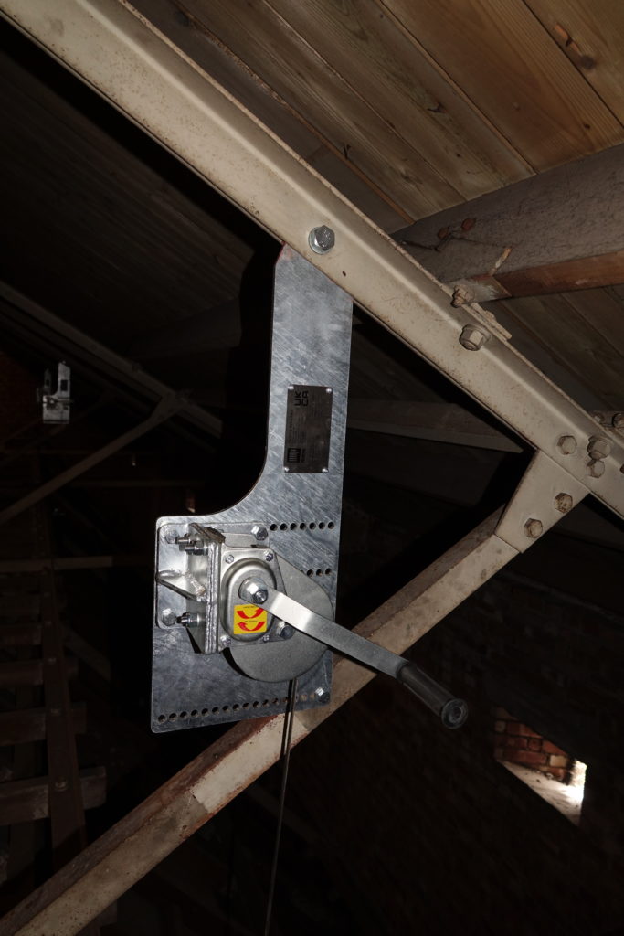 Bespoke winch mounted to a roof truss